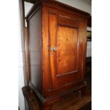 A mahogany bedside cabinet enclosed one door, on bracket feet, 16" wide