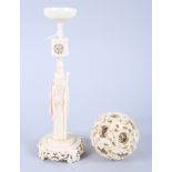 A Chinese carved ivory nesting ball with dragon design, on ivory stand formed as Lao Tzu, ball 2 1/