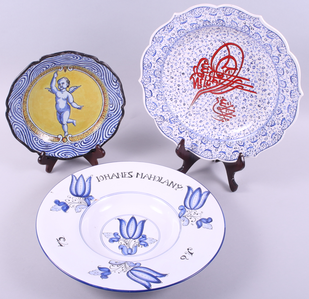 A majolica plate with armorial decoration on a yellow ground, 9" dia, a Delft bowl with tulip