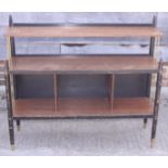 A 1950s walnut and ebonised brass mounted open bookcase, on turned supports, 41" wide x 37" high,