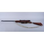 A BSA Meteor .22 calibre air rifle with a 4 x 20 scope and engraved decoration