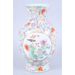 A Chinese porcelain baluster vase, decorated two panels of birds on a millefiori ground, seal mark