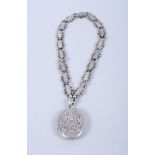 A Victorian white metal Aesthetic design locket and chain