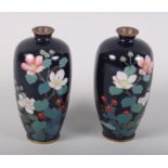 A pair of late 19th century Japanese oviform cloisonne vases with floral decoration, on a midnight