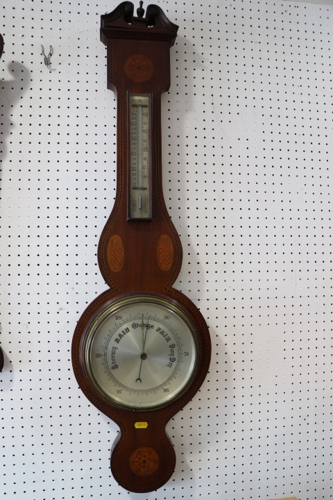 A mahogany and inlaid banjo barometer and thermometer with silvered dial