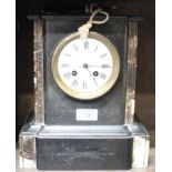 A black slate and marble mantel clock with white enamel dial and Roman numerals