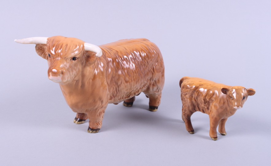 A Beswick model of a highland bull and a similar calf