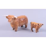 A Beswick model of a highland bull and a similar calf