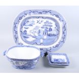 A "Willow" pattern meat platter, 20 1/2" wide, a tureen and four blue and white shredded wheat