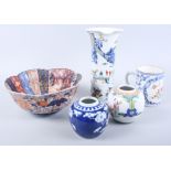 A Chinese export tankard, two ginger jars, an Imari bowl and a figure decorated vase