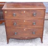 A 19th century mahogany chest of three long drawers with escutcheons, on splay bracket supports, 32"