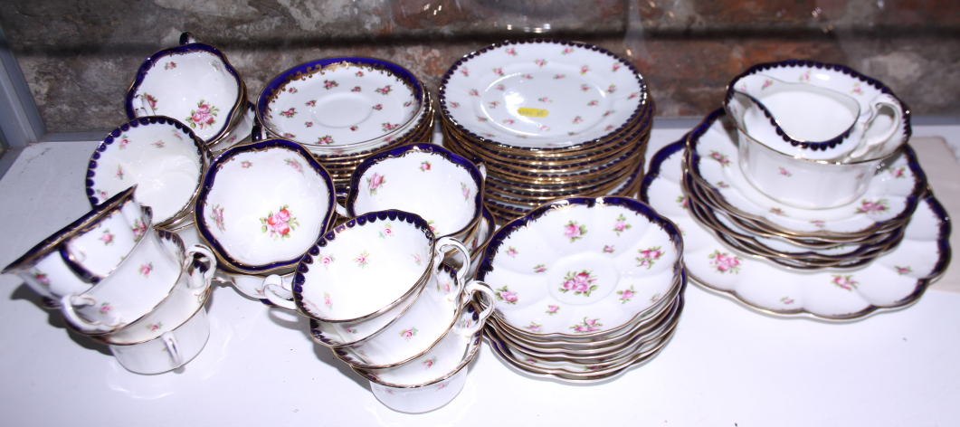 A Crescent bone china floral decorated part combination service