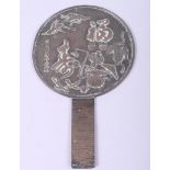 An Oriental bronze hand mirror