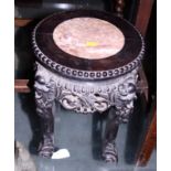 An Oriental carved hardwood vase stand, the top inset rouge marble panel