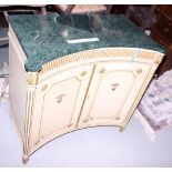 A cream and gilt decorated concave front cabinet, fitted marble top (damaged)