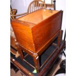 An early 20th century filing cabinet, fitted tambour shutter, on stand