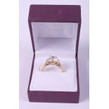 A 14ct gold ring set three brilliants, 4.1g gross