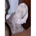 A weathered cast stone garden model of a basset hound, 21" high