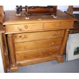 A pine chest of two short and three long drawers with flanking columns, 44" wide