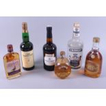 A bottle of Glenlivet whisky and five other bottles of assorted spirits