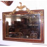 A 19th century bevelled plate wall mirror, in mahogany frame with giltwood urn and festoon surmount,