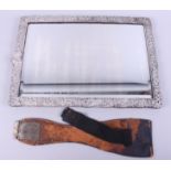 A silver framed mirror with pierced and embossed decoration, 16 1/2" x 11 1/2"