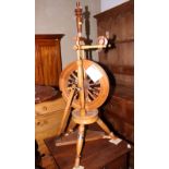 A Peter Teal fruitwood upright spinning wheel and accessories