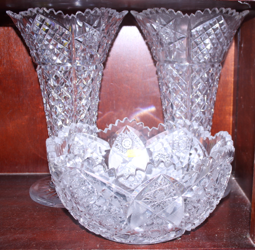 A pair of cut glass trumpet vases and a fruit bowl