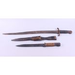 A French bayonet with curved blade, 22 1/2" long, and a bayonet with wooden handle and steel