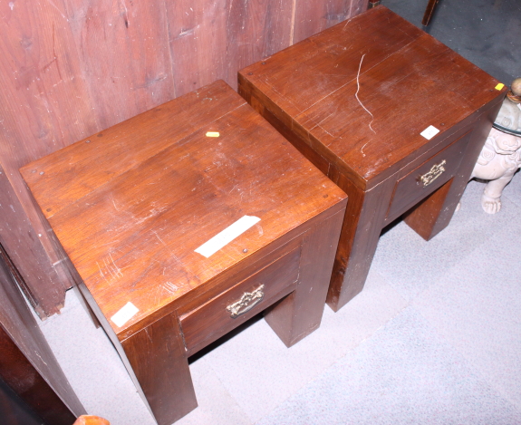 A pair of heavy bedside tables, on square supports