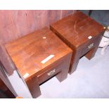 A pair of heavy bedside tables, on square supports