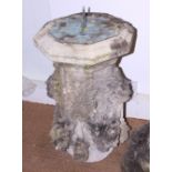 A 18th century carved stone pedestal with sundial, brass plate engraved "Thomas Bell London 1725