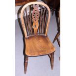 A set of six Windsor wheelback dining chairs with braced backs