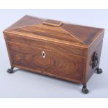 A rosewood and banded two-division tea caddy with lion face handles, 22" wide (damages)