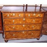 An early Georgian walnut and herringbone banded chest of two short and three long drawers, with