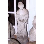 A weathered cast stone garden figure of a woman with a bird, 32" high