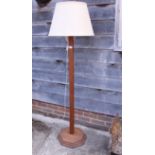 A light oak square-section standard lamp