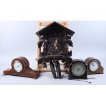 A Black Forest cuckoo clock, a French mahogany mantel clock with eight-day movement, a similar oak
