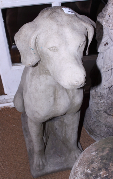 A cast stone garden model of a seated labrador, 28" high