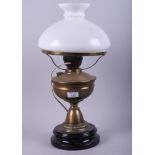 A brass pedestal oil lamp with white glass shade (now converted to electricity)
