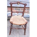A child's late 19th century wicker seat side chair