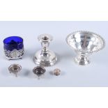 A sterling silver pedestal bowl with weighted base, a silver candlestick, a pair of silver salts,