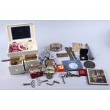 An assortment of costume jewellery, including beaded necklaces, cufflinks, clock keys, an autograph