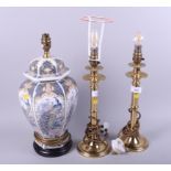 A pair of brass pillar table lamps and another table lamp, on Chinese vase base