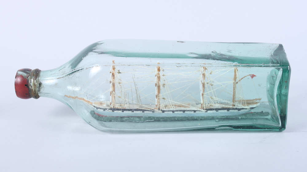 A model of a ship in a bottle, 10" wide