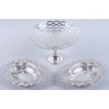 A silver pedestal sweetmeat basket with pierced decoration and a pair of bonbon dishes with