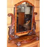 A Victorian mahogany framed swing mirror, on serpentine base, 28" wide