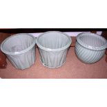A set of three green glazed leaf moulded planters and one stand, 18" dia