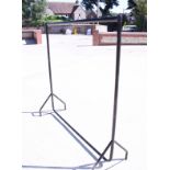A pair of black painted industrial size clothes rails, 60" long