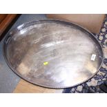 An oval silver plated two-handled tray with pierced gallery, 24" long